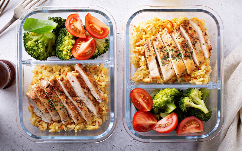 Birdseye view of chicken and rice meal prepped containers.