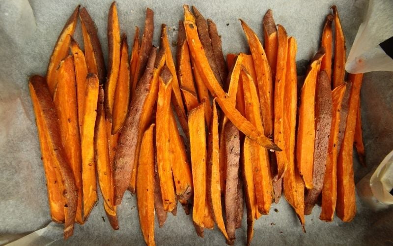 Sweet potato fries on parchment paper. 