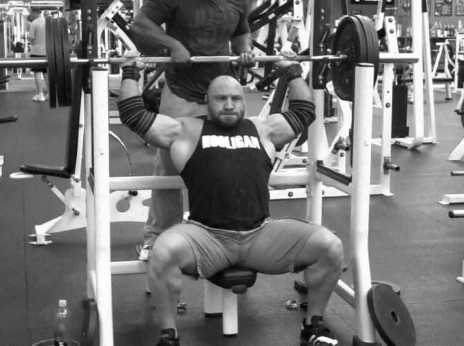 Paul Carter performing behind the neck press
