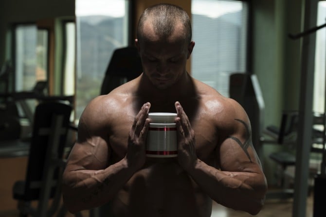 Man holding testosterone booster