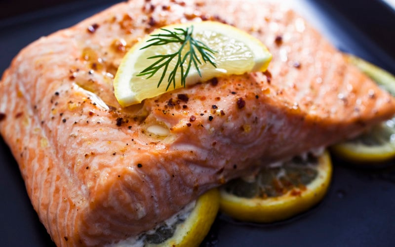 baked salmon topped with lemon