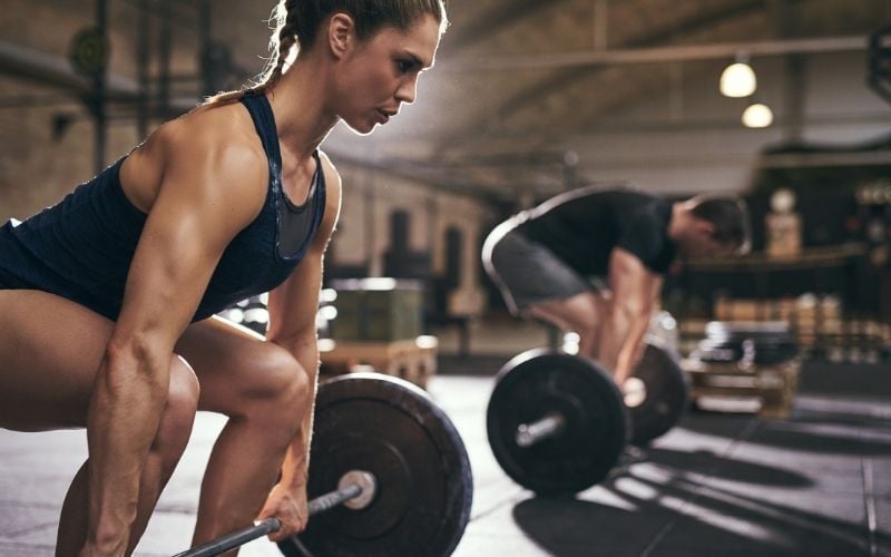 Woman prepping for deadlift.