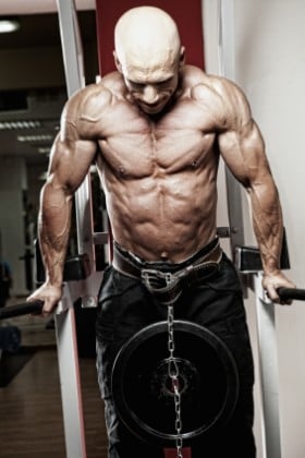 Shredded lifter performing dips