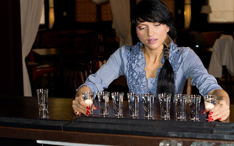 Women Drinking Alcohol Shots In Bar