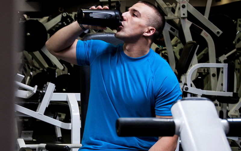 Man Drinking Protein Shake In The Gym