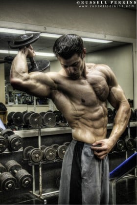 Robbie Sardinia flexing abs and serratus.