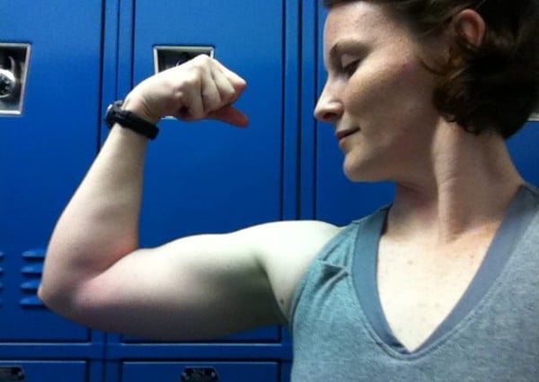 Katherine Wilburn flexes her bicep.