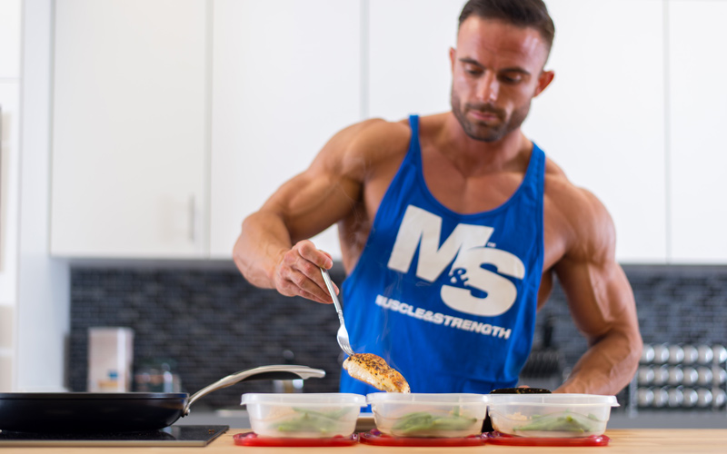 Meal Prep: The Ultimate Guide - Portioning meals into tupperware