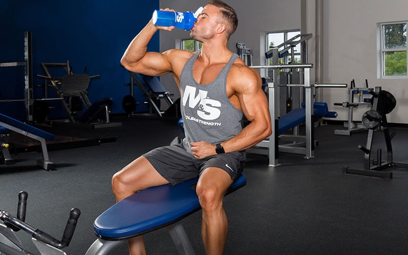 Muscle and Strength Athlete Drinking NO Supplements from Blender Bottle