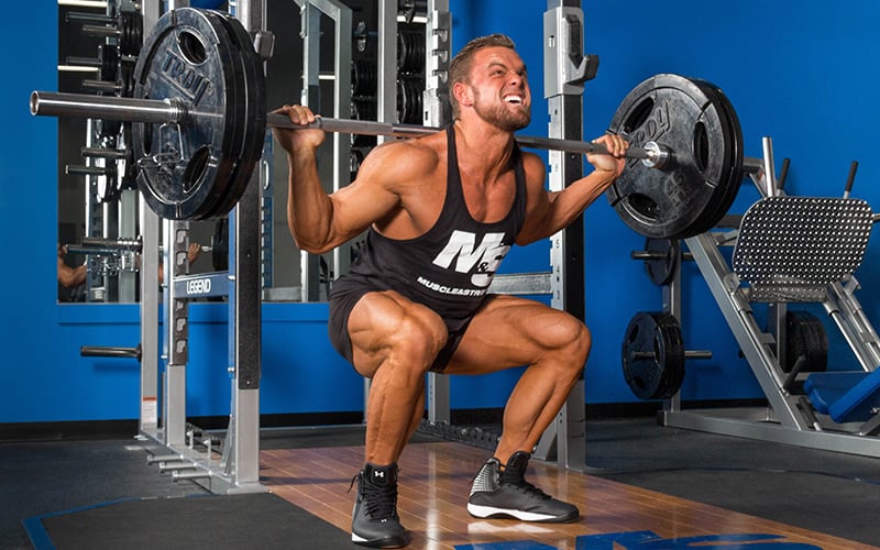 M&S Athlete Performing Barbell Back Squats