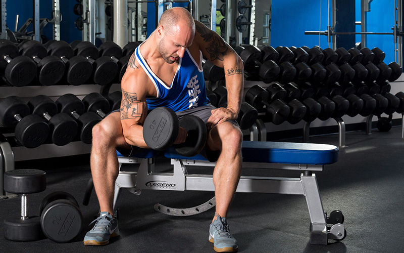 M&S Athlete Performing Concentrated Curls