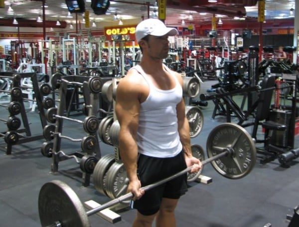 Derek Charlesbois performing barbell curls.
