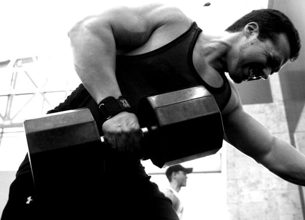 Derek Charlesbois performing dumbbell rows.