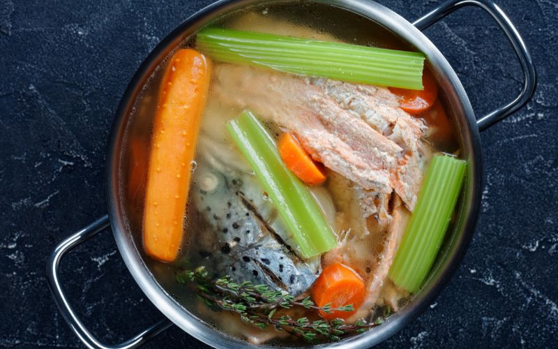 Birdseye shot of a broth mixture in the pot.