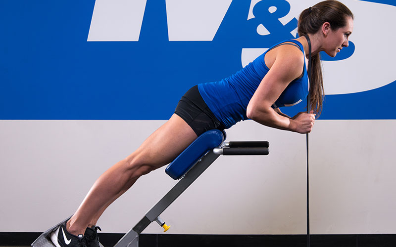 M&S Athlete Training Her Core by Performing Hyperextensions